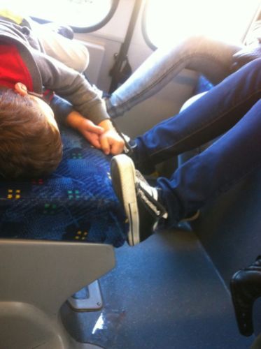 Feet on seat ( from Please keep feet off seats on buses and trains @Facebook)